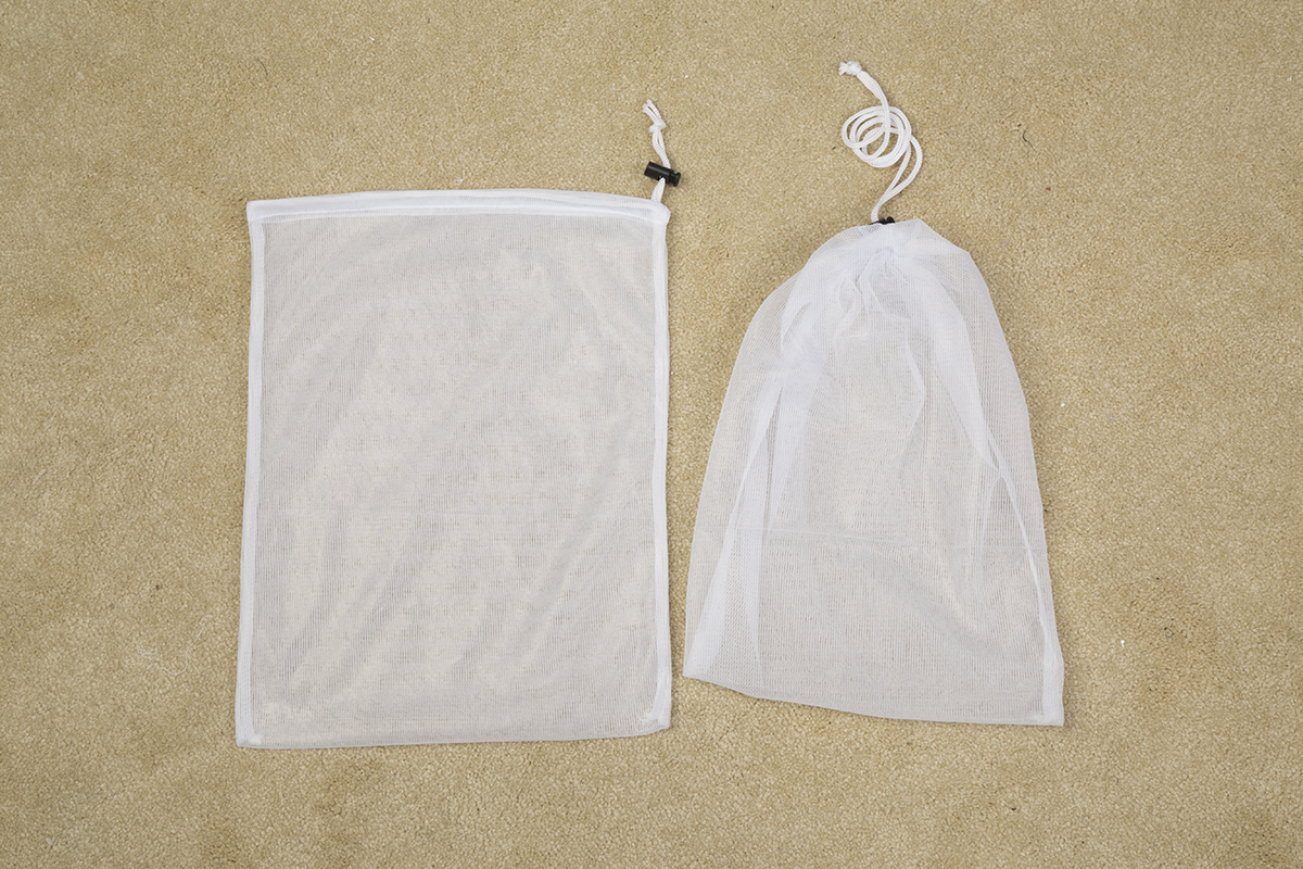 El lavadero del precio bajo empaqueta el bolso modificado para requisitos particulares del lavado de la malla del color para el uso en el hogar